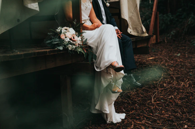 how to elope : bride and groom sitting next to each other